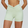 SPARK Twisted High Waist Yoga Shorts in green