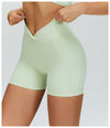 SPARK Twisted High Waist Yoga Shorts in green side