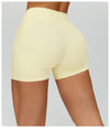 SPARK Twisted High Waist Yoga Shorts in yellow back