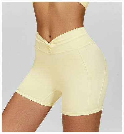 SPARK Twisted High Waist Yoga Shorts in yellow side
