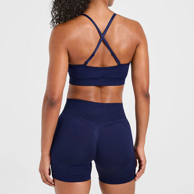 Self-adjusting seamless yoga bra & shorts in navy setback