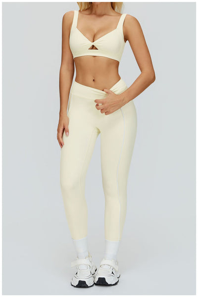 Women's Twist Hollow Open Back Yoga Fitness Bra in light yellow a set leggings