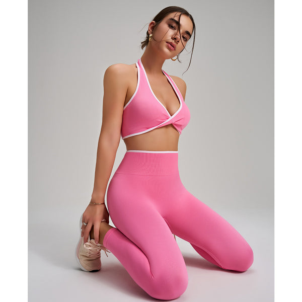 Women wearing Yoga Leggings and Sports Bra Set. in pink side